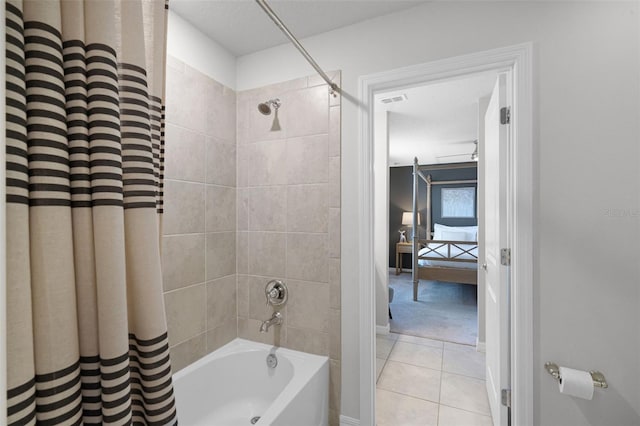 2131 Lelani Cir, Davenport, FL 33897 - bathroom featuring shower / tub combo with curtain and tile patterned flooring