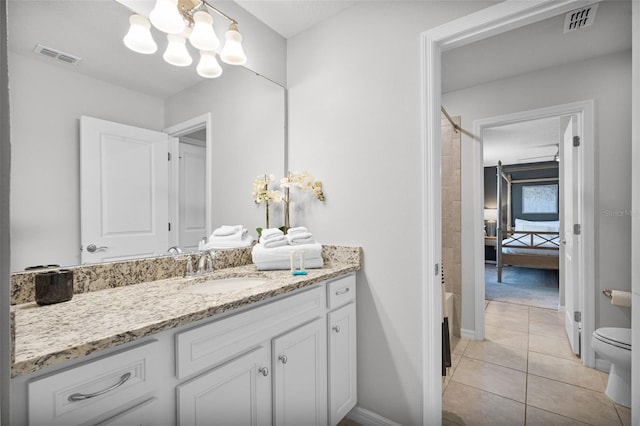 2131 Lelani Cir, Davenport, FL 33897 - bathroom with vanity, a chandelier, and tile patterned flooring