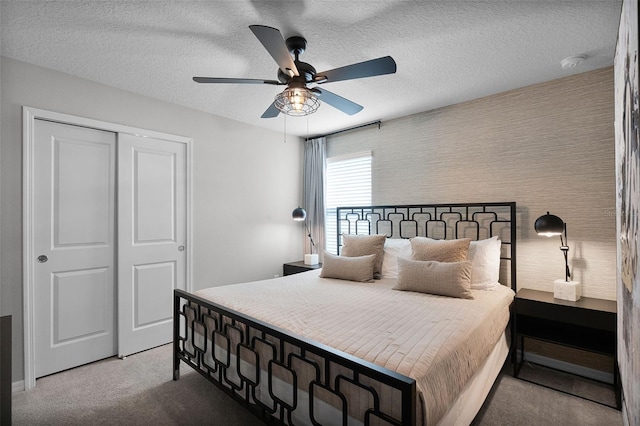 2131 Lelani Cir, Davenport, FL 33897 - carpeted bedroom with a closet, ceiling fan, and a textured ceiling