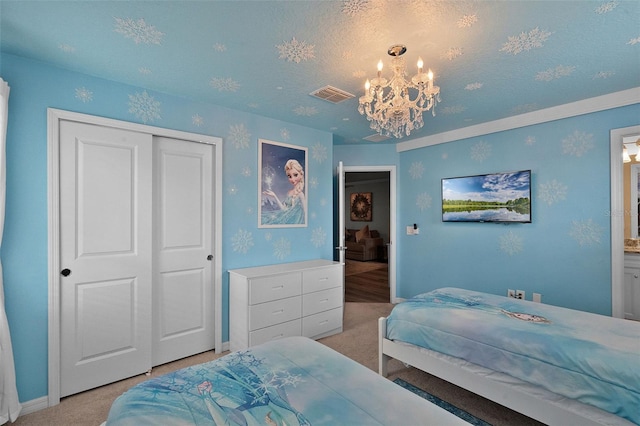 2131 Lelani Cir, Davenport, FL 33897 - bedroom featuring light colored carpet, a chandelier, and a closet