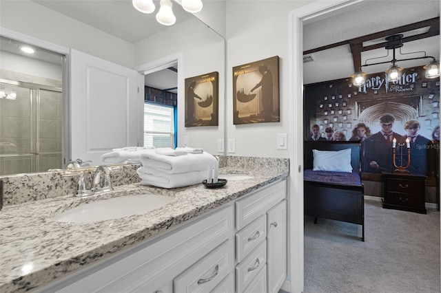 2131 Lelani Cir, Davenport, FL 33897 - full bathroom with double vanity, connected bathroom, a shower stall, and a chandelier