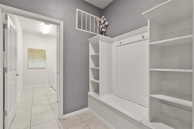 2131 Lelani Cir, Davenport, FL 33897 - mudroom featuring light tile patterned flooring and baseboards