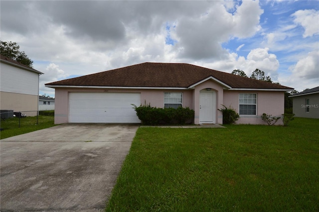 1207 Atlantic Ct, Kissimmee, FL 34759 - single story home with stucco siding, concrete driveway, a front yard, and a garage