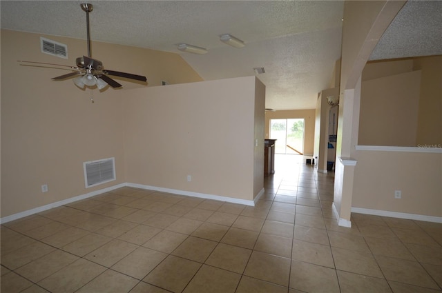 1207 Atlantic Ct, Kissimmee, FL 34759 - empty room with a textured ceiling, light tile patterned floors, ceiling fan, and lofted ceiling