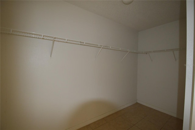 1207 Atlantic Ct, Kissimmee, FL 34759 - walk in closet with light tile patterned floors