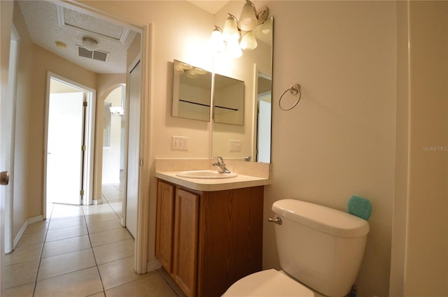 1207 Atlantic Ct, Kissimmee, FL 34759 - half bathroom featuring vanity, tile patterned flooring, and a textured ceiling