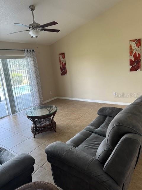 5435 Bryce Canyon Dr, Kissimmee, FL 34758 - living room featuring ceiling fan, tile patterned flooring, and lofted ceiling