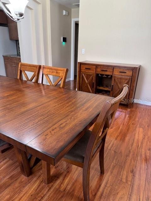5435 Bryce Canyon Dr, Kissimmee, FL 34758 - dining room with dark wood-style floors