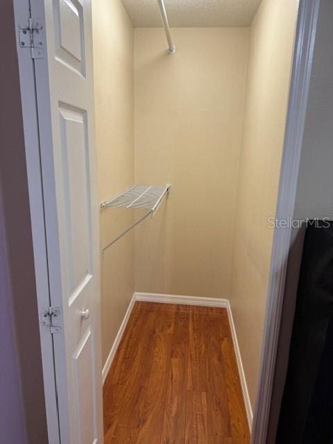 5435 Bryce Canyon Dr, Kissimmee, FL 34758 - walk in closet featuring wood finished floors