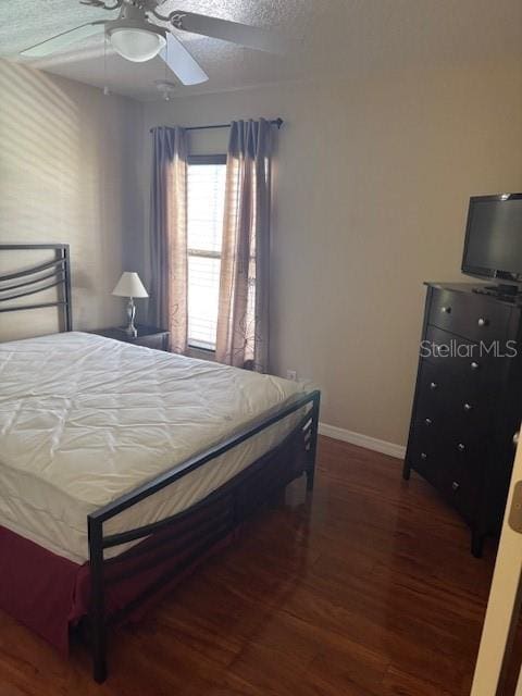 5435 Bryce Canyon Dr, Kissimmee, FL 34758 - bedroom featuring wood finished floors and a ceiling fan