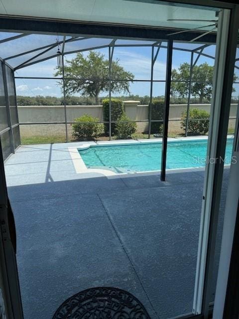 5435 Bryce Canyon Dr, Kissimmee, FL 34758 - view of swimming pool featuring a lanai and a patio