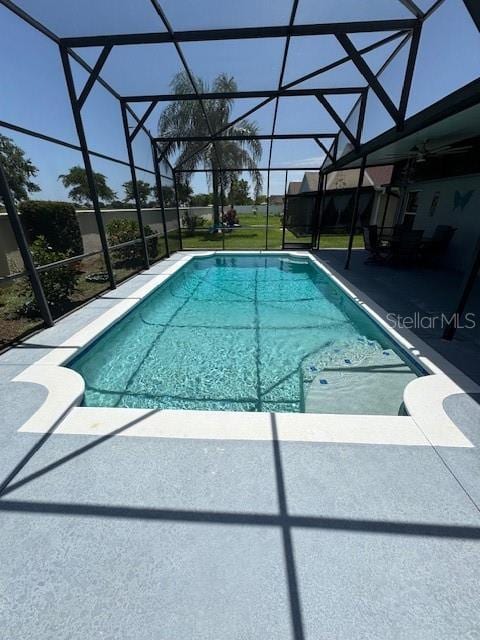 5435 Bryce Canyon Dr, Kissimmee, FL 34758 - outdoor pool featuring glass enclosure and a patio