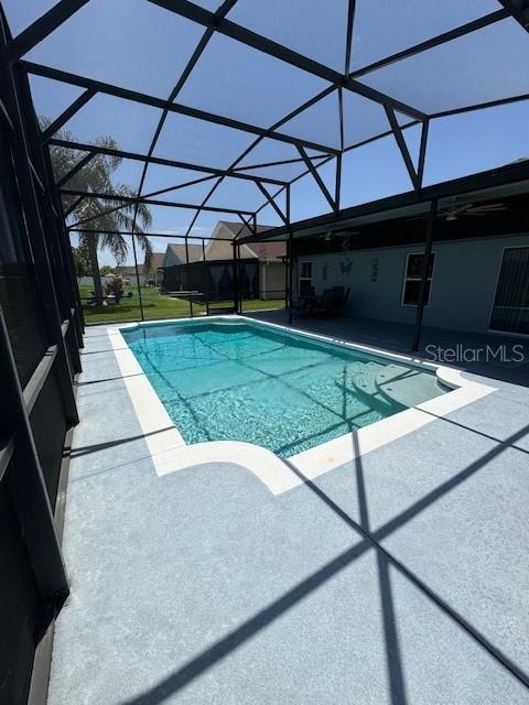 5435 Bryce Canyon Dr, Kissimmee, FL 34758 - outdoor pool featuring a patio area and a lanai