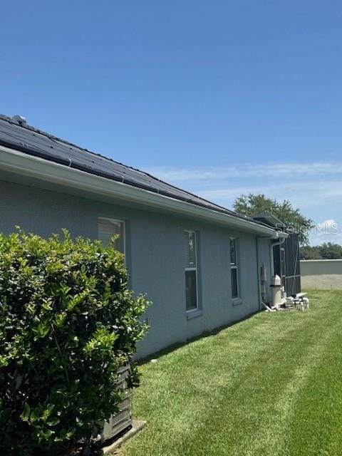 5435 Bryce Canyon Dr, Kissimmee, FL 34758 - view of side of property with stucco siding and a yard