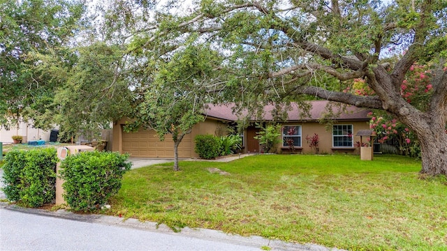 11649 Crescent Pines Blvd, Clermont, FL 34711 - view of front of property featuring stucco siding, a front lawn, an attached garage, and driveway