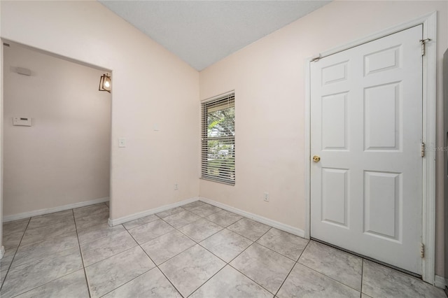 11649 Crescent Pines Blvd, Clermont, FL 34711 - unfurnished room with lofted ceiling and light tile patterned flooring