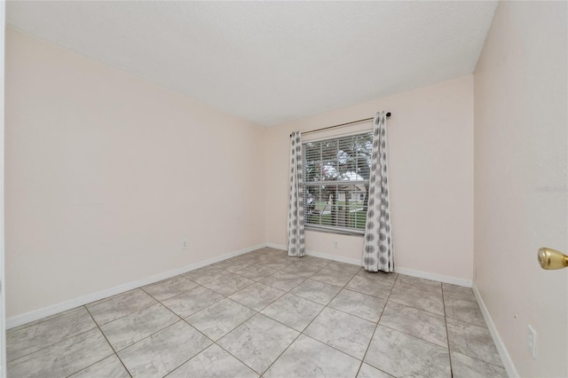 11649 Crescent Pines Blvd, Clermont, FL 34711 - empty room with baseboards and light tile patterned floors