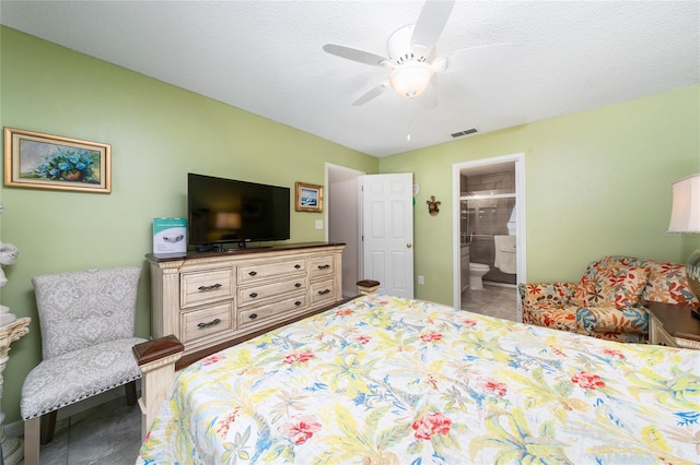 11649 Crescent Pines Blvd, Clermont, FL 34711 - bedroom with tile patterned floors, a ceiling fan, and connected bathroom