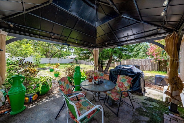 11649 Crescent Pines Blvd, Clermont, FL 34711 - fenced backyard featuring a patio, a gazebo, grilling area, and outdoor dining space