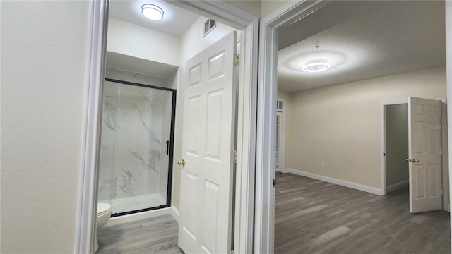 235 Goldenrain Dr Unit 102, Kissimmee, FL 34747 - hallway featuring wood finished floors and baseboards