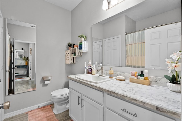 2436 Bulrush Dr, Saint Cloud, FL 34769 - bathroom featuring vanity, wood finished floors, and a shower with shower curtain