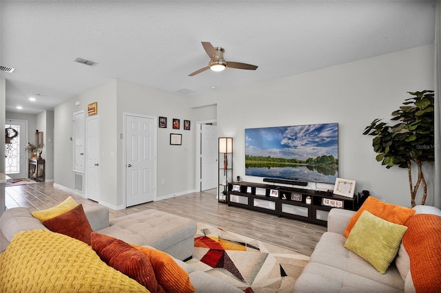 2436 Bulrush Dr, Saint Cloud, FL 34769 - living area with wood finished floors and ceiling fan