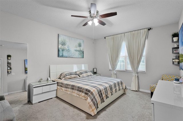 2436 Bulrush Dr, Saint Cloud, FL 34769 - bedroom with light carpet, a ceiling fan, and a textured ceiling