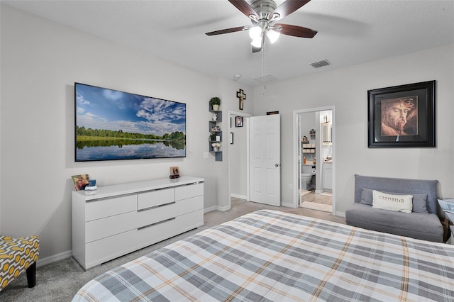 2436 Bulrush Dr, Saint Cloud, FL 34769 - bedroom featuring light colored carpet, ensuite bath, and a ceiling fan