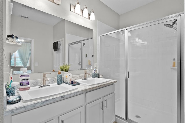 2436 Bulrush Dr, Saint Cloud, FL 34769 - bathroom featuring double vanity and a stall shower