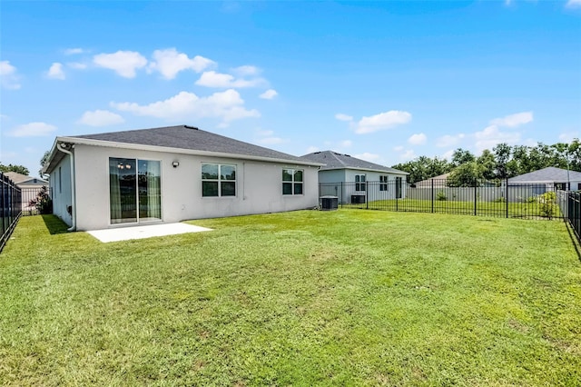 2436 Bulrush Dr, Saint Cloud, FL 34769 - rear view of property with stucco siding, a patio, and a fenced backyard