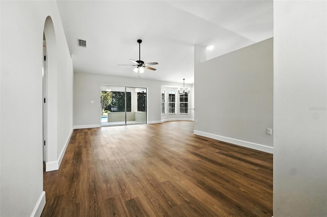 4635 Deer Run Rd, Saint Cloud, FL 34772 - unfurnished living room featuring a ceiling fan, wood finished floors, and arched walkways
