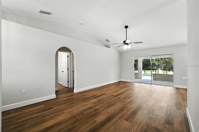 4635 Deer Run Rd, Saint Cloud, FL 34772 - spare room with ceiling fan, vaulted ceiling, arched walkways, and dark wood-style flooring