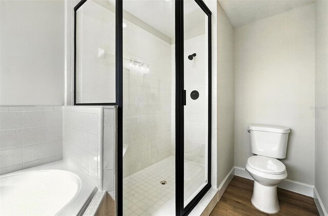 4635 Deer Run Rd, Saint Cloud, FL 34772 - full bathroom featuring a garden tub, a shower stall, and wood finished floors