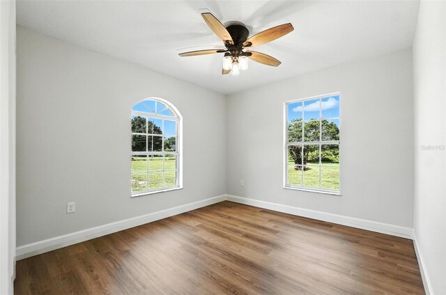4635 Deer Run Rd, Saint Cloud, FL 34772 - empty room featuring wood finished floors and ceiling fan