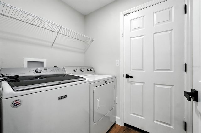 4635 Deer Run Rd, Saint Cloud, FL 34772 - washroom featuring washing machine and dryer and dark wood finished floors