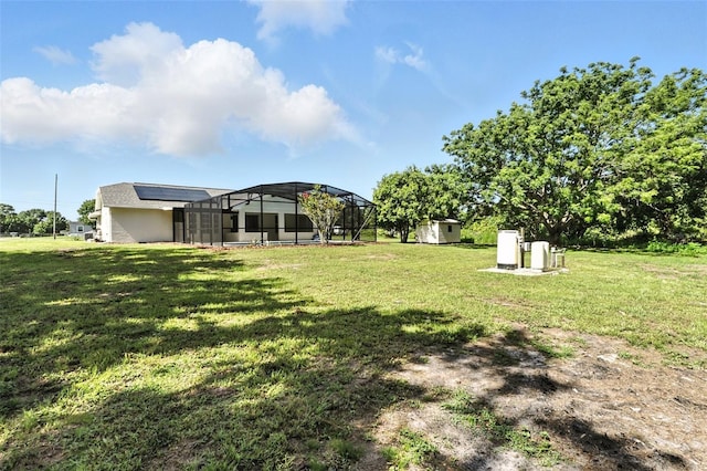 4635 Deer Run Rd, Saint Cloud, FL 34772 - view of grassy yard with a storage unit and a lanai