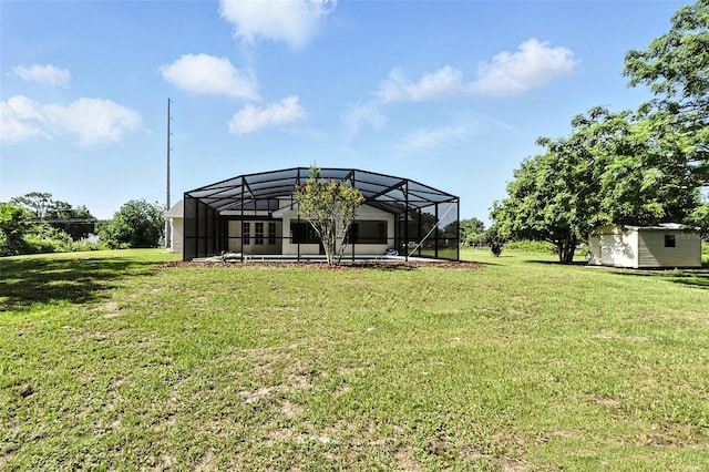 4635 Deer Run Rd, Saint Cloud, FL 34772 - view of grassy yard featuring a storage unit and a lanai