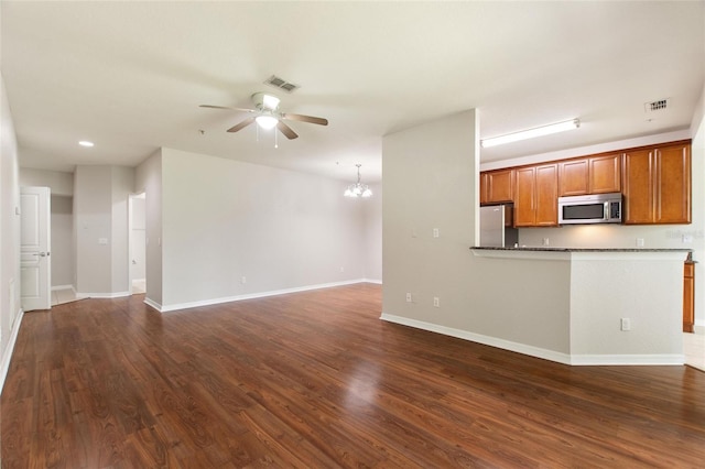 8309 Bella Vida Cir Unit 8309, Davenport, FL 33896 - unfurnished living room with a ceiling fan, dark wood-style flooring, a chandelier, and recessed lighting