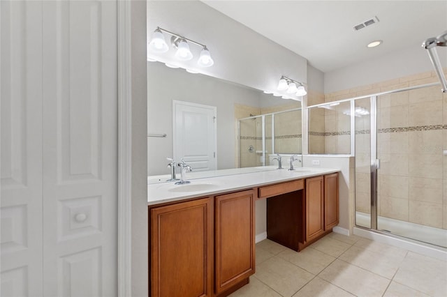 8309 Bella Vida Cir Unit 8309, Davenport, FL 33896 - bathroom with a shower stall, double vanity, and tile patterned floors