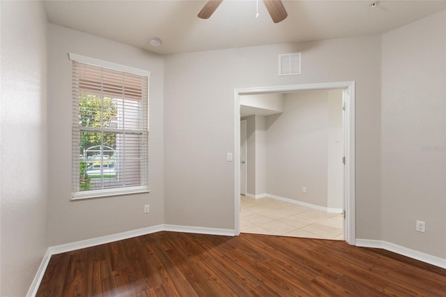8309 Bella Vida Cir Unit 8309, Davenport, FL 33896 - spare room featuring wood finished floors, a ceiling fan, and a smoke detector