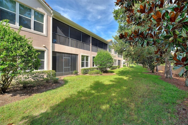 8309 Bella Vida Cir Unit 8309, Davenport, FL 33896 - view of green lawn featuring a sunroom