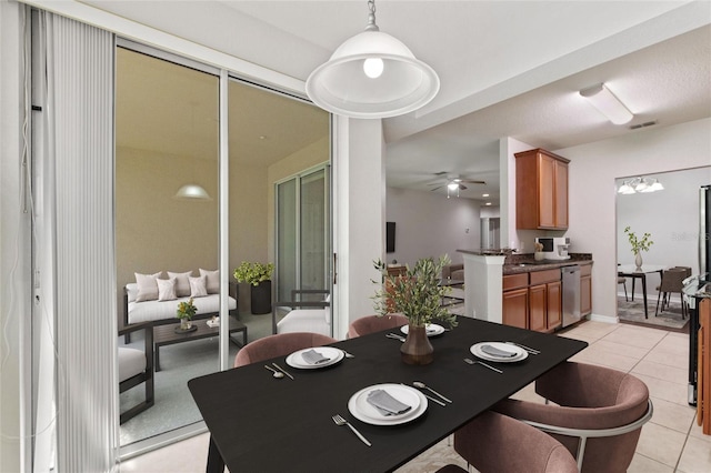 8309 Bella Vida Cir Unit 8309, Davenport, FL 33896 - dining space with light tile patterned flooring and a ceiling fan