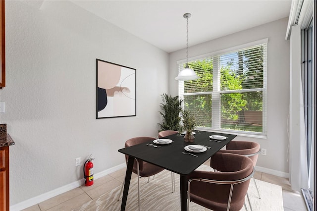 8309 Bella Vida Cir Unit 8309, Davenport, FL 33896 - dining room featuring light tile patterned flooring and a textured wall