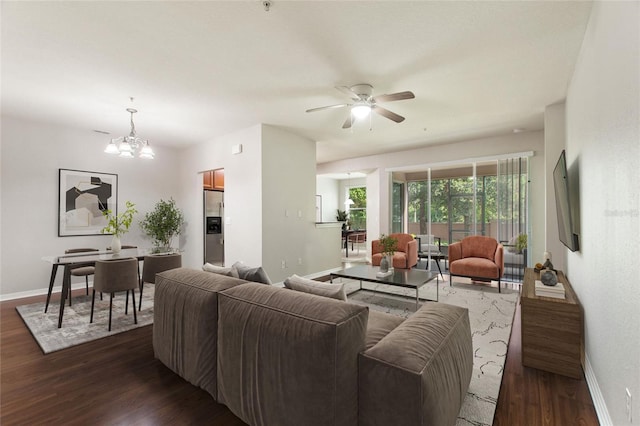 8309 Bella Vida Cir Unit 8309, Davenport, FL 33896 - living area with dark wood-style floors, a ceiling fan, and a chandelier