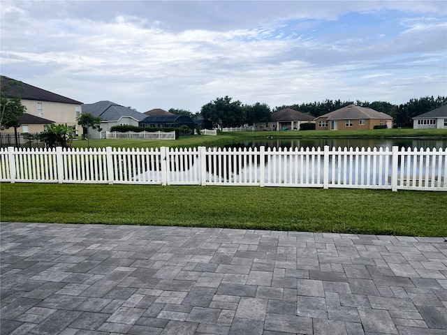 3799 Cedar Hammock Trl, Saint Cloud, FL 34772 - view of patio featuring a fenced front yard, a residential view, and a water view