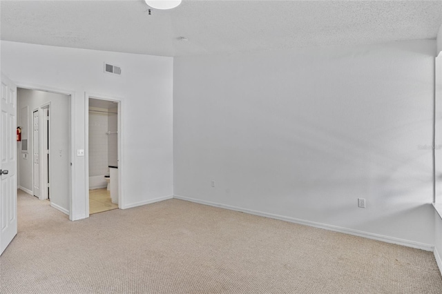 1645 Windsor Oak Ct, Kissimmee, FL 34744 - unfurnished bedroom with light carpet and a textured ceiling