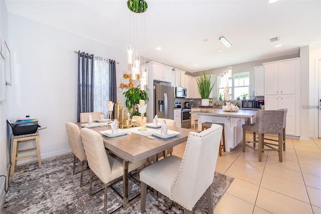2463 Volunteer Ave, Kissimmee, FL 34744 - dining space featuring recessed lighting and light tile patterned floors