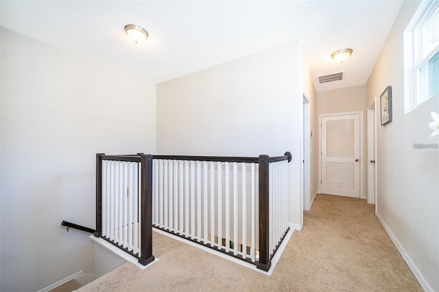 2463 Volunteer Ave, Kissimmee, FL 34744 - corridor featuring an upstairs landing and carpet floors