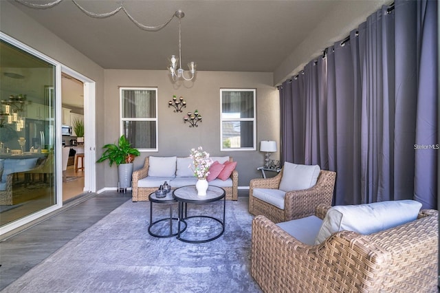 2463 Volunteer Ave, Kissimmee, FL 34744 - living area featuring a chandelier and wood finished floors