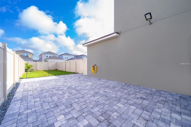 2463 Volunteer Ave, Kissimmee, FL 34744 - fenced backyard with a patio area and a residential view
